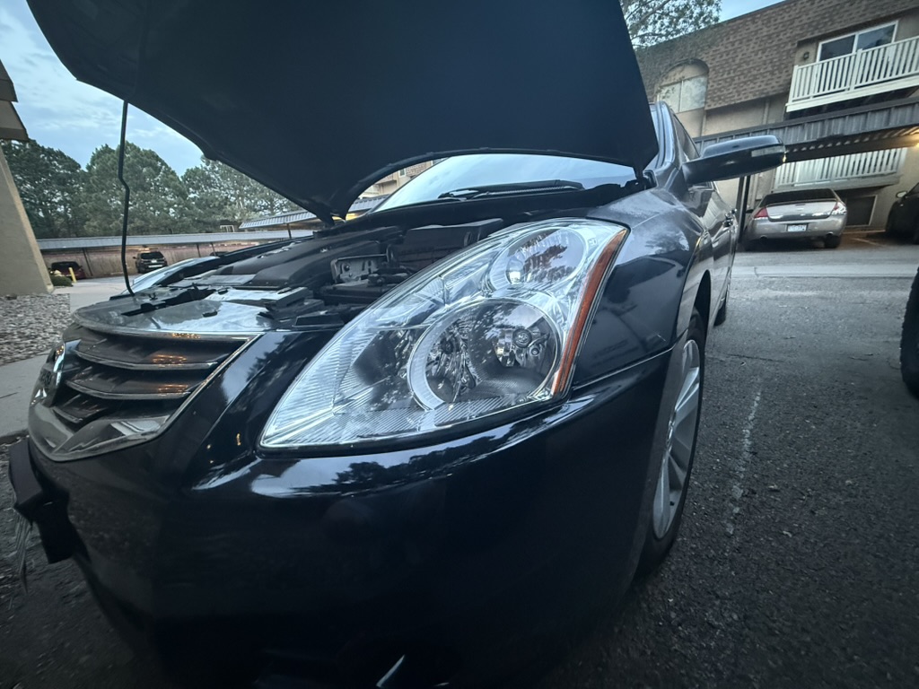 2011 Nissan Altima after headlight restoration — clear, like-new headlights