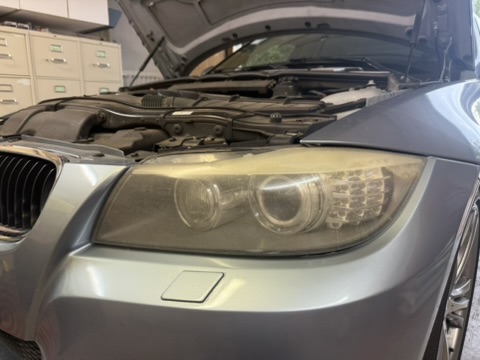 BMW before headlight restoration — cloudy, yellowed headlights