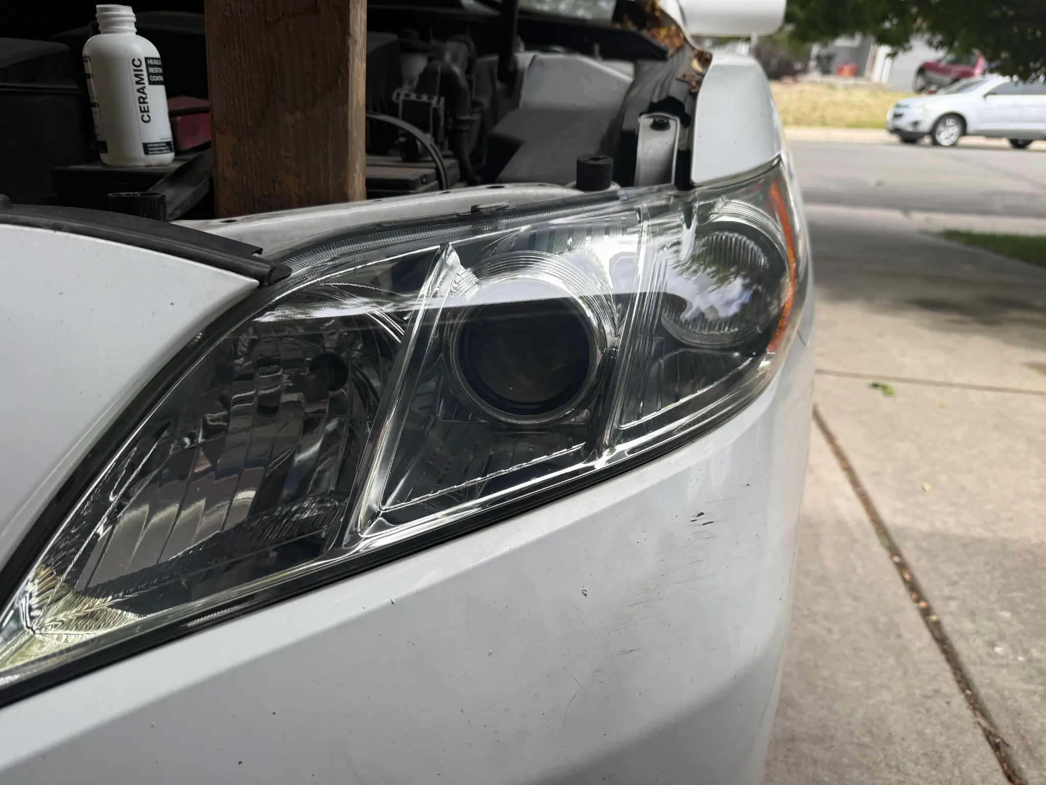 2009 Toyota Camry after headlight restoration — clear, like-new headlights