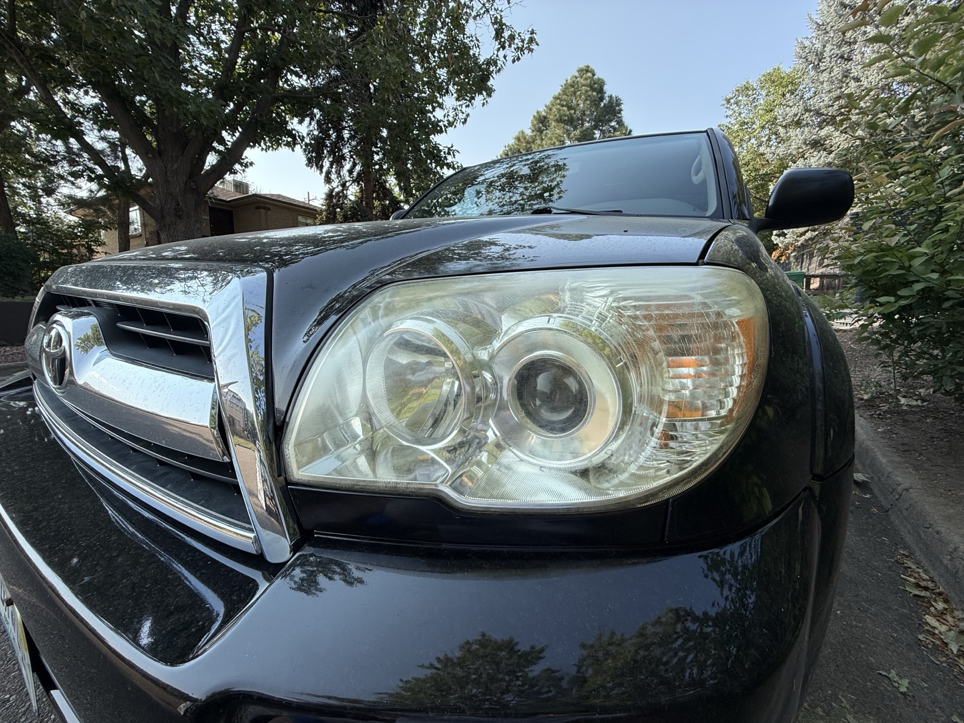 Toyota 4Runner before headlight restoration — cloudy, yellowed headlights
