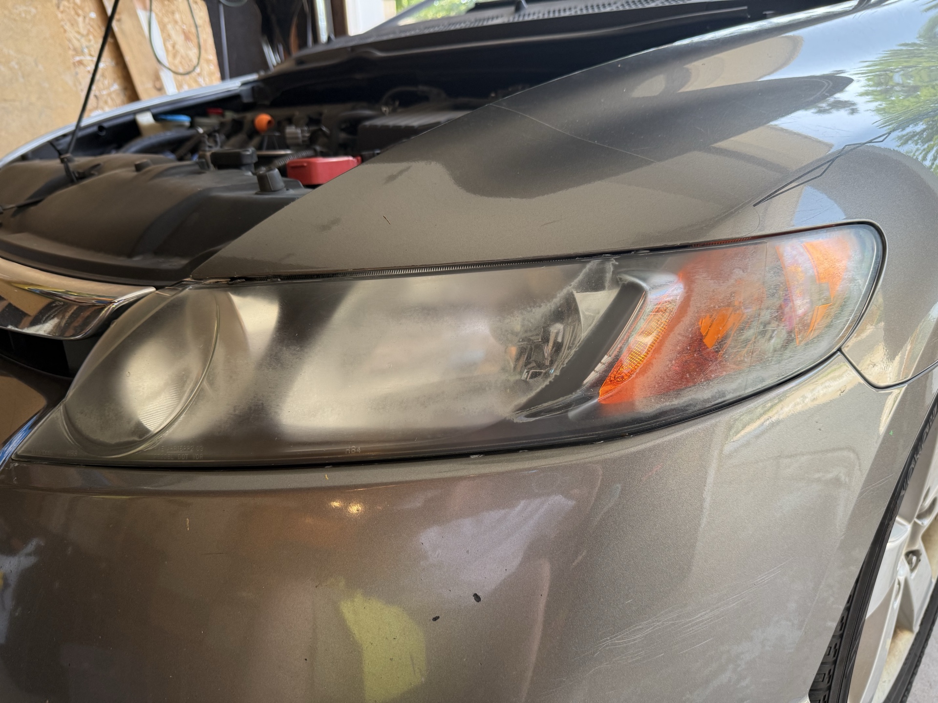 Honda Civic before headlight restoration — cloudy, yellowed headlights