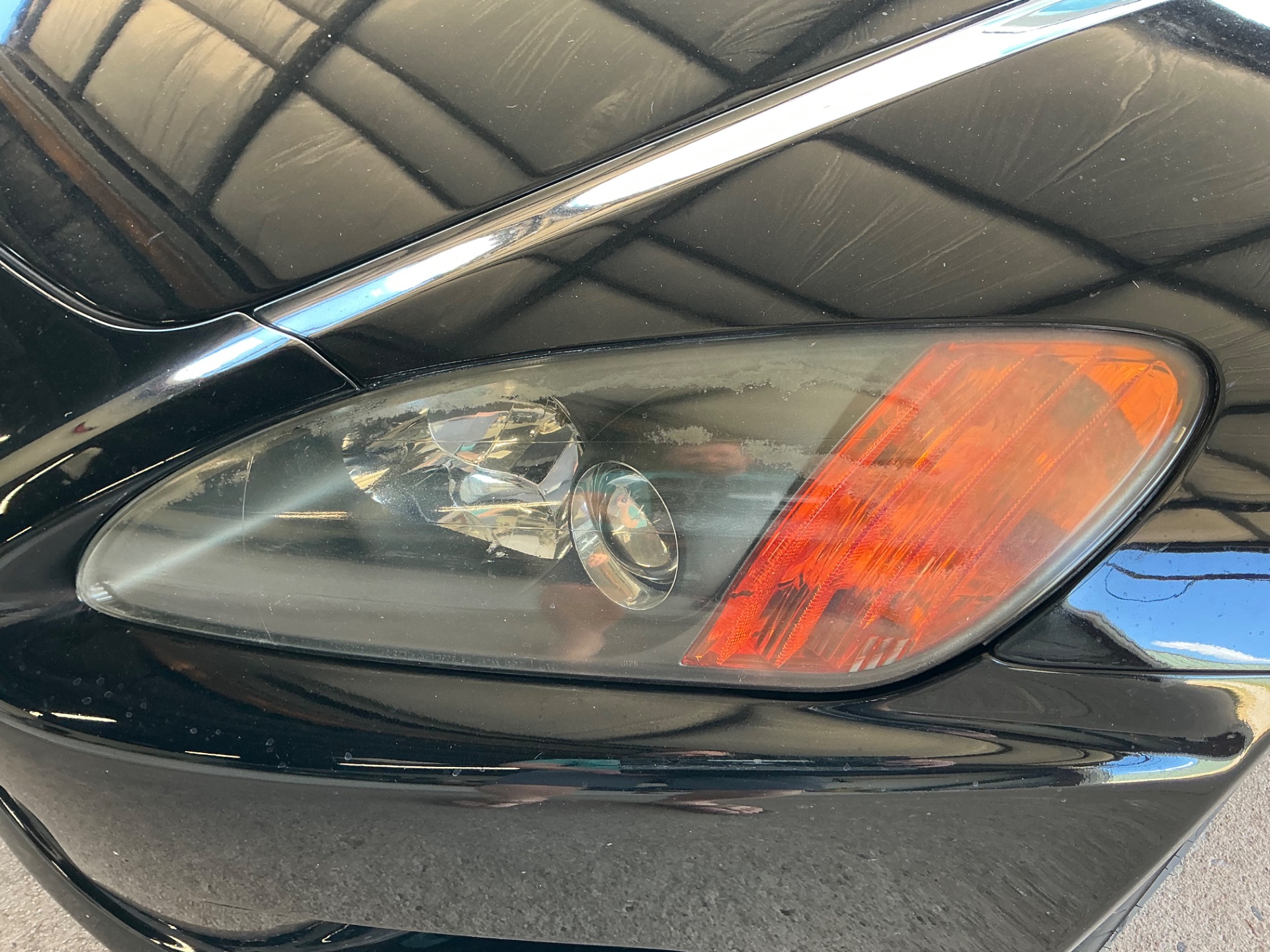 2002 Honda S2000 before headlight restoration — cloudy, yellowed headlights